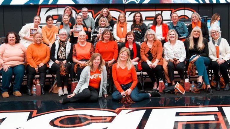 First Lady Jean Callahan (front row, right) with other women leaders from the campus and community at a women's basketball game