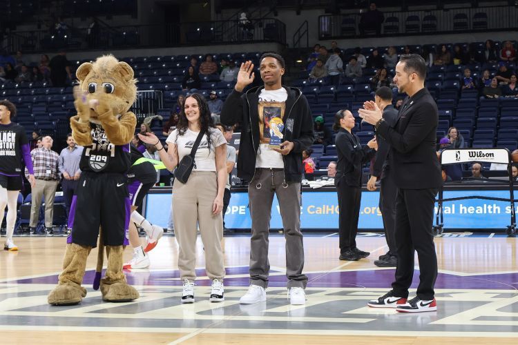 Pacific men's basketball player Lesown Hallums was recognized at a Stockton Kings game.