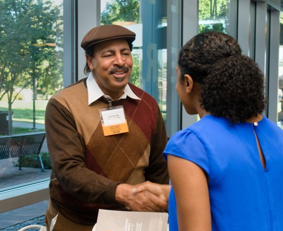 Donor shakes hand with student at the annual Pharmacy Scholarship Ceremony