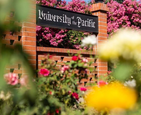 University of the Pacific sign surrounded by roses