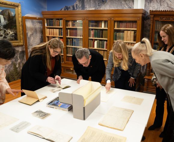 regents look at materials from the library's john muir collection