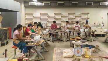 Ceramics students working with clay
