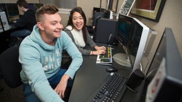 students analyzing data at a computer